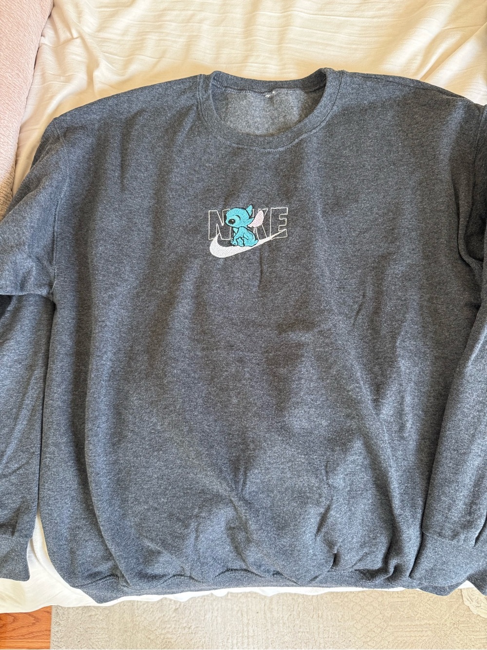 Nike Women's Dark Gray Crewneck Sweatshirt with Blue Stitch Graphic